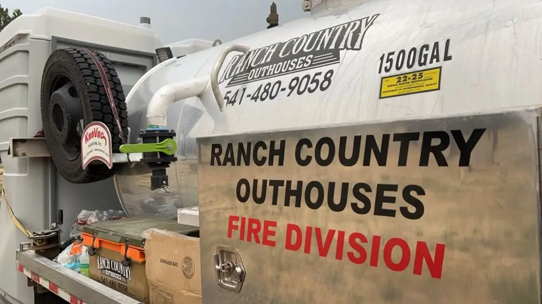 Ranch Country Outhouses lettering on the side of a pump truck tank